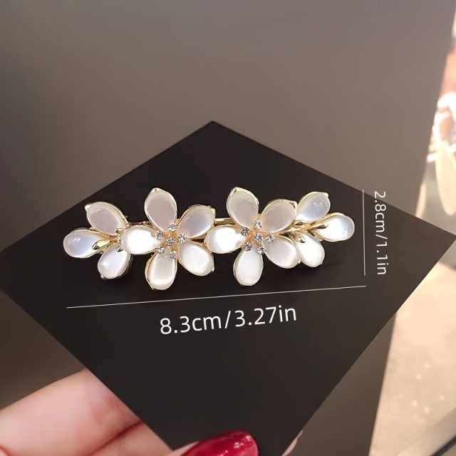Elegantna sponka za lase s cvetličnim motivom